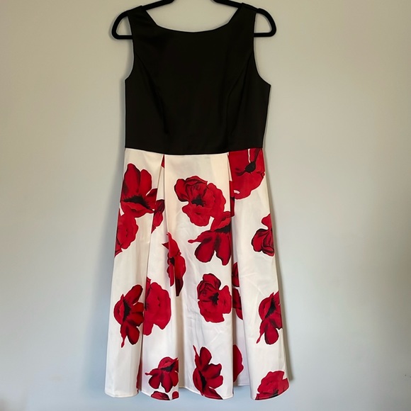 SHE’S t-length dress with red flower detail on the pleats, black sleeveless top - Picture 1 of 6